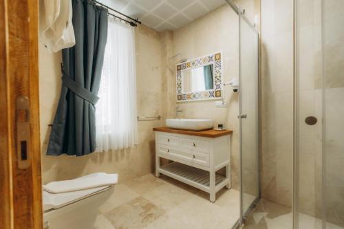 a bathroom with a sink and a shower at Cappadocia Villa Comfort in Nevşehir