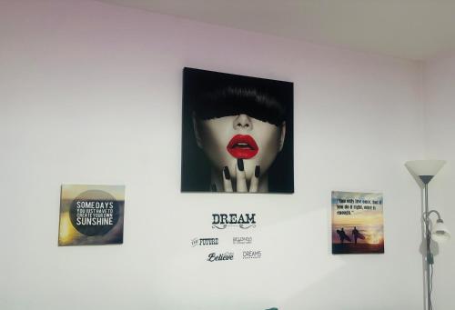 a picture of a woman with red lipstick on a wall at ModernStudio in Bragadiru