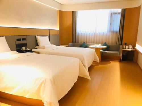 Cama o camas de una habitación en JI Hotel Tai'an Guangcai