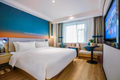 Кровать или кровати в номере NIHAO Hotel Lanzhou Xiguan Zhengning Road