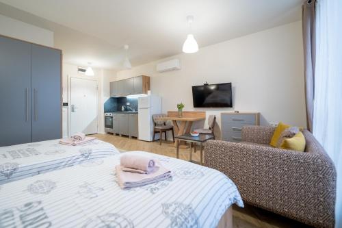 a living room with two beds and a couch at WOW studios for rent - bul Montevideo 25A - B in Sofia