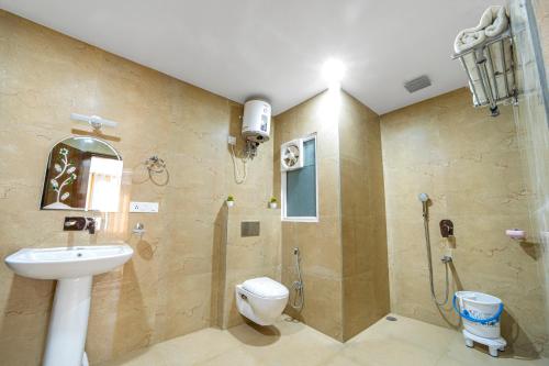 a bathroom with a shower and a toilet and a sink at Lifespace Rishikesh- Hotel, Hostel, Cowork, Cafe in Rishīkesh