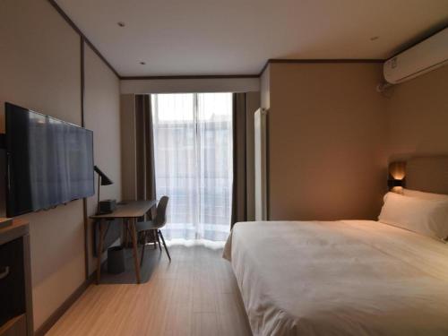 Katil atau katil-katil dalam bilik di Hanting Hotel Beijing Huangcun Qingyuan North Road
