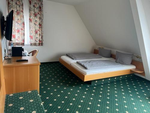 Katil atau katil-katil dalam bilik di Hotel Landgasthof Blume