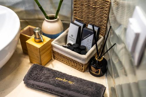 a bathroom counter with a box of soap and other items at Margo Cozy Houses in Mavrovouni
