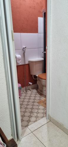 a bathroom with a toilet and a sink at Pousada da Didi in Belém