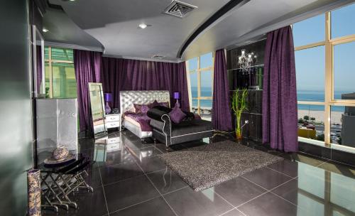 a living room with purple curtains and a couch at Bravo Royal Hotel Suites in Kuwait