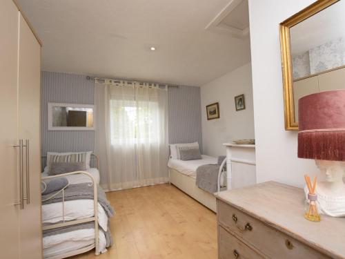 a small room with two beds and a kitchen at 6 Bed in Buckland Brewer SWOLD in Buckland Brewer