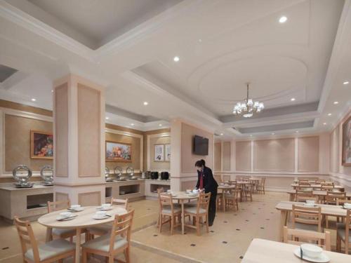 Restoran ili neka druga zalogajnica u objektu Vienna Hotel Nanjing Lishui Development Zone Jichang Road