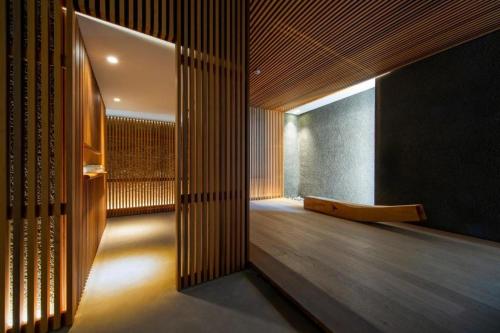 a hallway with wood paneling and a wooden floor at Namu Hotel in Seoul