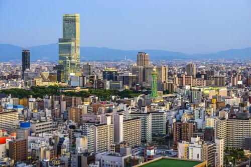 a view of a city with tall buildings at Bijou Suites Will in Osaka