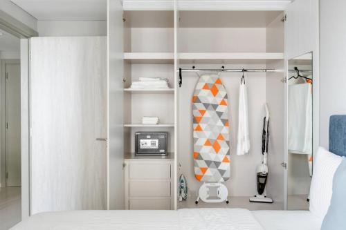 a bedroom with a bed and a tv in it at Pool View One Bed Room Business Bay in Dubai