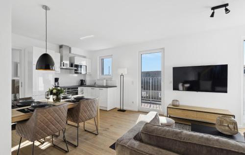 a living room with a couch and a table at Sonnendeck in Winterberg