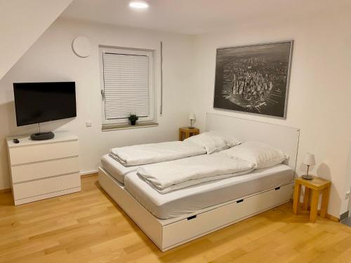Кровать или кровати в номере Wohnung 9