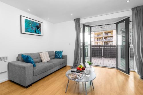 a living room with a couch and a table at City Centre Penthouse - Large Balcony - 2 Bedroom - Secure Parking 1001M in Birmingham