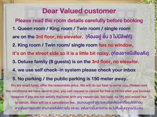 a sign in a window that reads dear valued customer at Achcha hotel - itsaraphap MRT station - Wat Arun in Bangkok