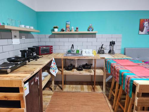 a kitchen with a sink and a counter top at Alojamiento San Francisco - Apartamentos y habitaciones in Lima