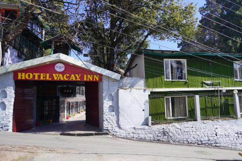 an entrance to a hotel waayin inn on a street at Vacay inn Hotel in Nainital