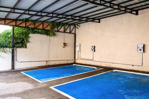 an empty room with two blue mats on the floor at Marigold Thermal & Spa Hotel Bursa in Bursa