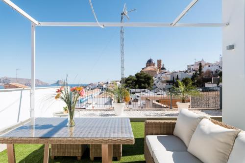 a balcony with a table and a view of the city at Atico Vistas al Mar, Terraza, Piscina y Parking by Vero in Altea