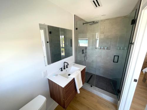 a bathroom with a sink and a shower at Shore View Hotel in Hollywood