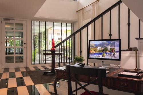 a computer monitor sitting on a desk in a room at Cayena-Caracas in Caracas