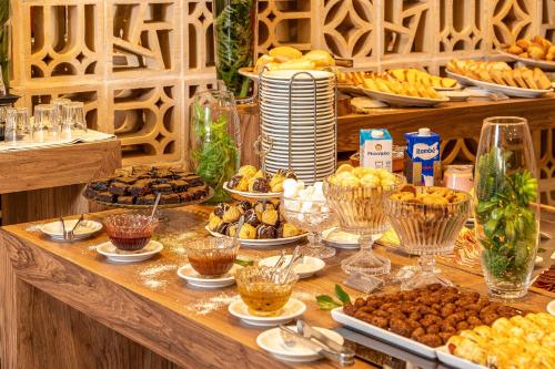 a buffet with many different types of food on a table at Ucayali Hotel in Sinop