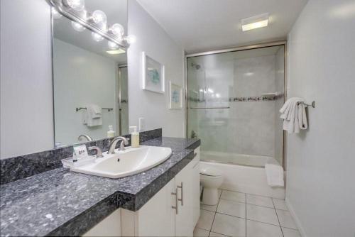 a bathroom with a sink and a toilet and a shower at Bay Shores in San Diego