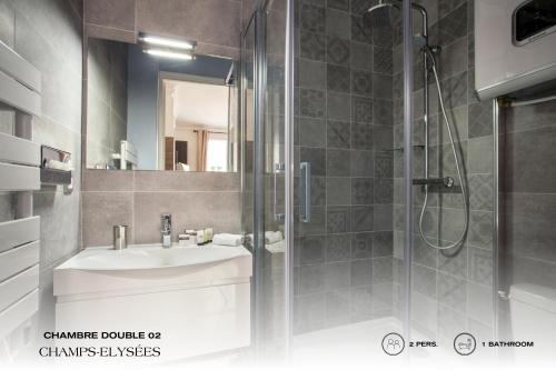 a bathroom with a shower and a sink and a shower at Beauquartier - Champs-Elysées in Paris