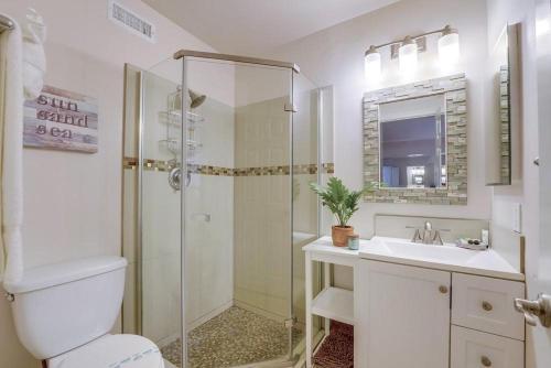 a bathroom with a shower and a toilet and a sink at Beach Haven 1 in San Diego