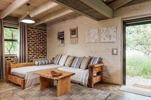 a living room with a couch and a table at Glenda's Guest Suites in Midrand