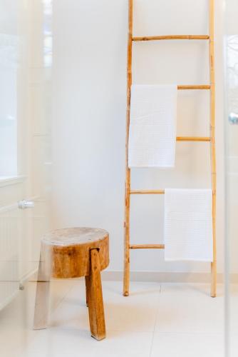 a stool and a ladder in a room at Aarskogs Boutique Hotel in Glücksburg