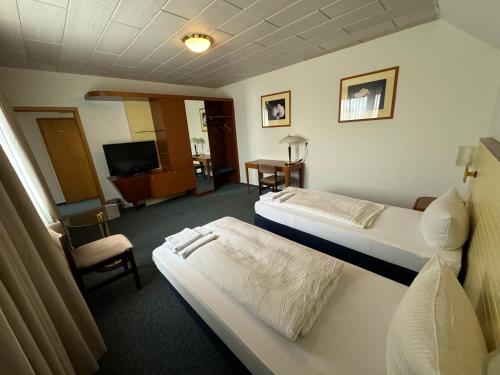 Ένα ή περισσότερα κρεβάτια σε δωμάτιο στο Hotel Zum Klüverbaum