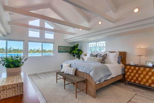 a bedroom with a large bed and a large window at Boardwalk 4 in San Diego