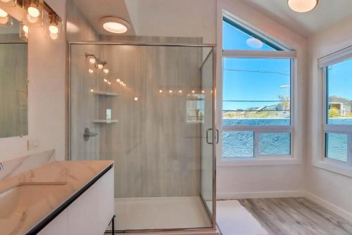 a bathroom with a shower and a large window at Boardwalk 4 in San Diego