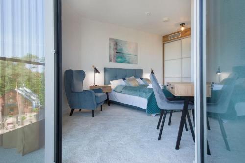 Posteľ alebo postele v izbe v ubytovaní Apartament Premium PINEA 413