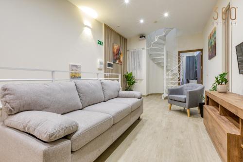 a living room with a couch and a chair at Authentic & Spacious 3BR home with Private Terrace by 360 Estates in Rabat