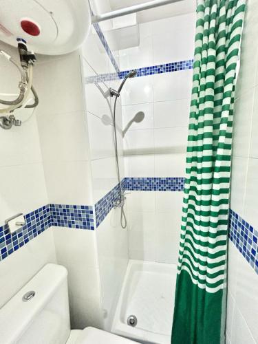 a bathroom with a shower and a toilet at Madrid Rio Antonio Lopez A in Madrid