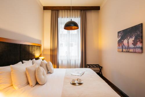 Ένα ή περισσότερα κρεβάτια σε δωμάτιο στο Topolowa Residence - LoftAffair Collection