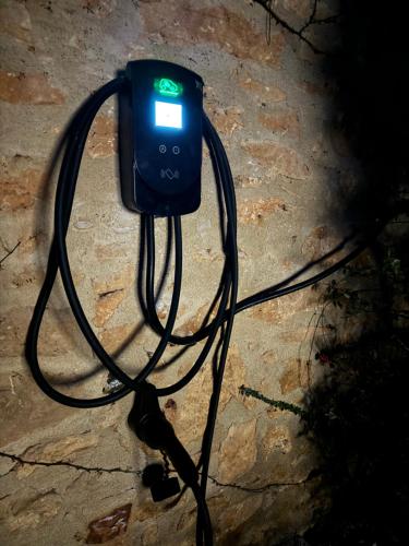 an electronic device is sitting on the ground at Chambres d’hôtes de Pouzatel in Fumel