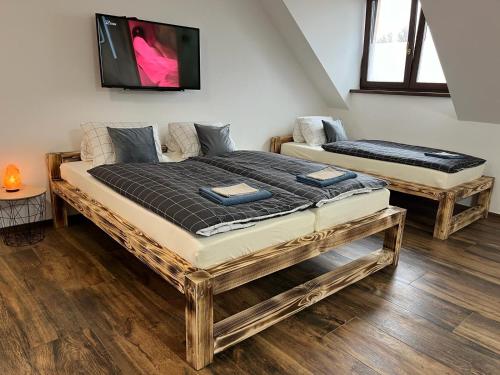Postel nebo postele na pokoji v ubytování Apartmán KUGA