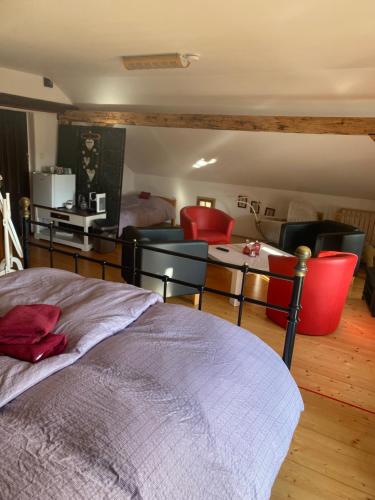 a bedroom with a bed and a living room at Droom b&b Čermná in Čermná