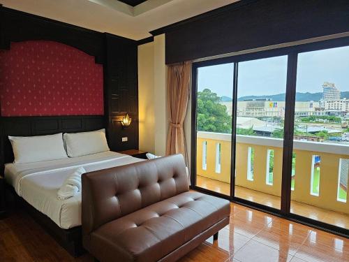 Cama o camas de una habitación en Nanai 2 Residence Patong Phuket