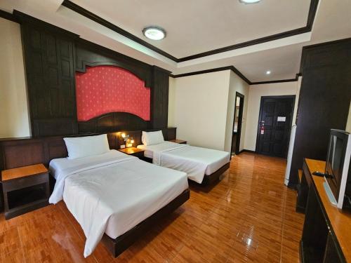 Postel nebo postele na pokoji v ubytování Nanai 2 Residence Patong Phuket
