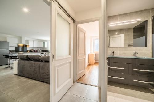 a large kitchen with a sink and a counter at Appartement proche station - 7 pers in Châtillon-sur-Cluses
