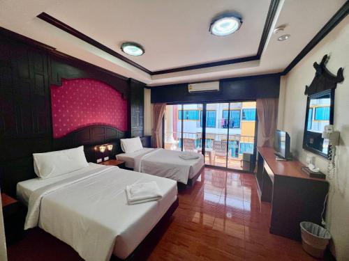 Cama o camas de una habitación en Nanai 2 Residence Patong Phuket