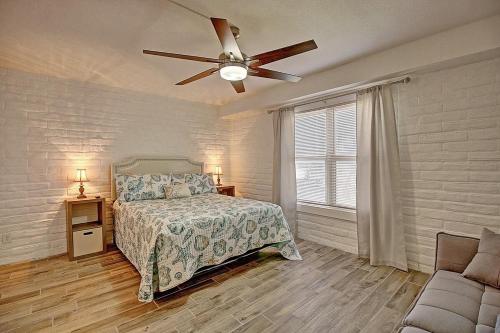 a bedroom with a bed and a ceiling fan at A Salty Day Getaway at Sea Sands Condominiums in Port Aransas