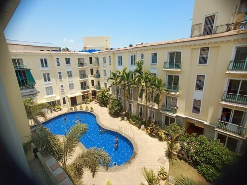 an overhead view of a large building with a swimming pool at Asta by Avim in Goa