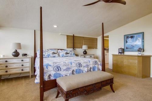 a bedroom with a bed and a ceiling fan at Treasure Villa in San Diego