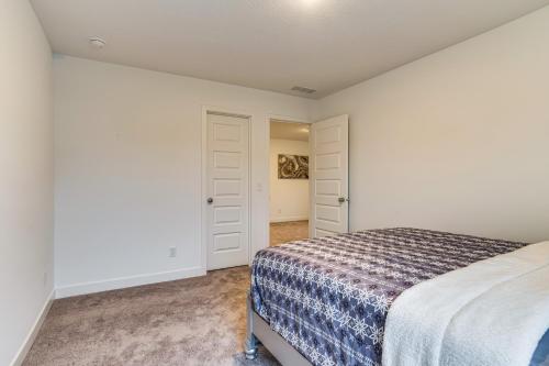 a bedroom with a bed and a closet at Quiet Avon Home - Near Indianapolis Speedway! in Avon